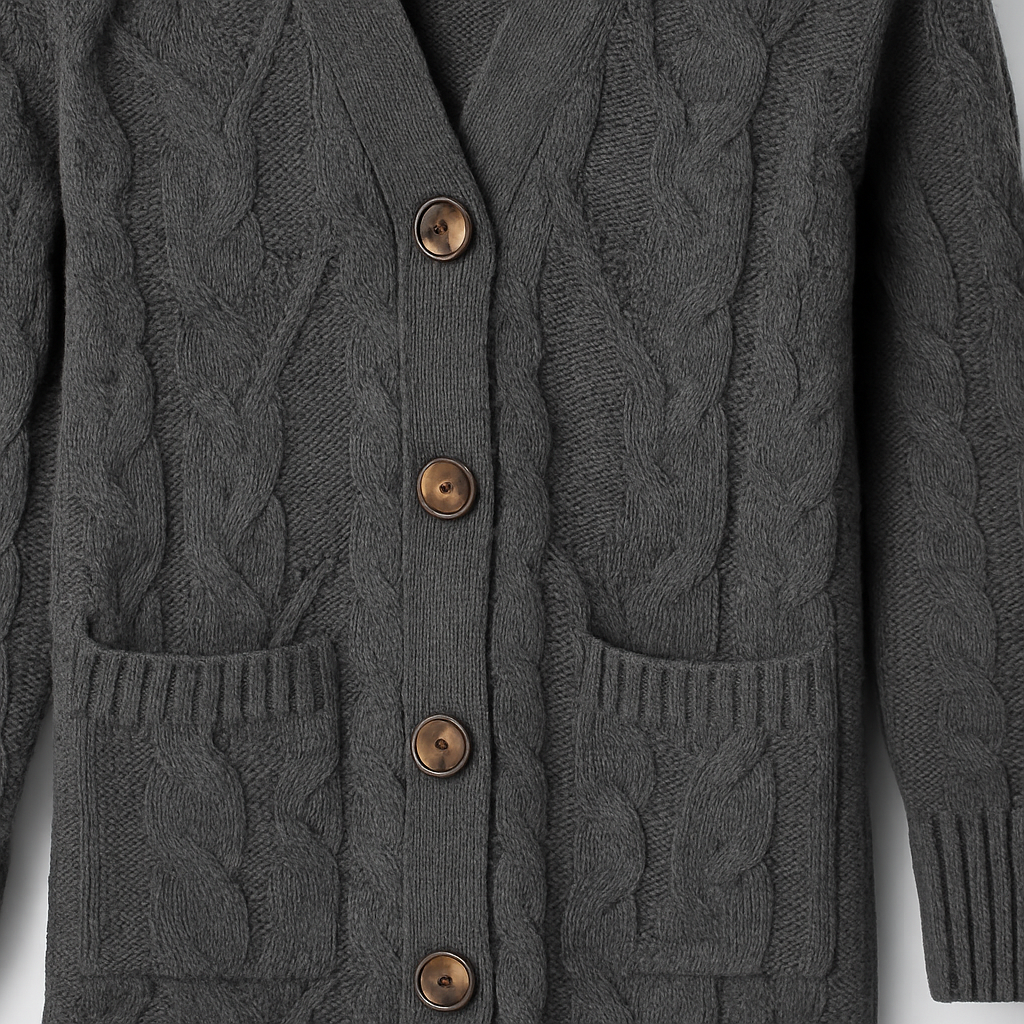 Long cable-knit cardigan with button-front closure, ribbed cuffs and hem, and front patch pockets, designed for cozy layering