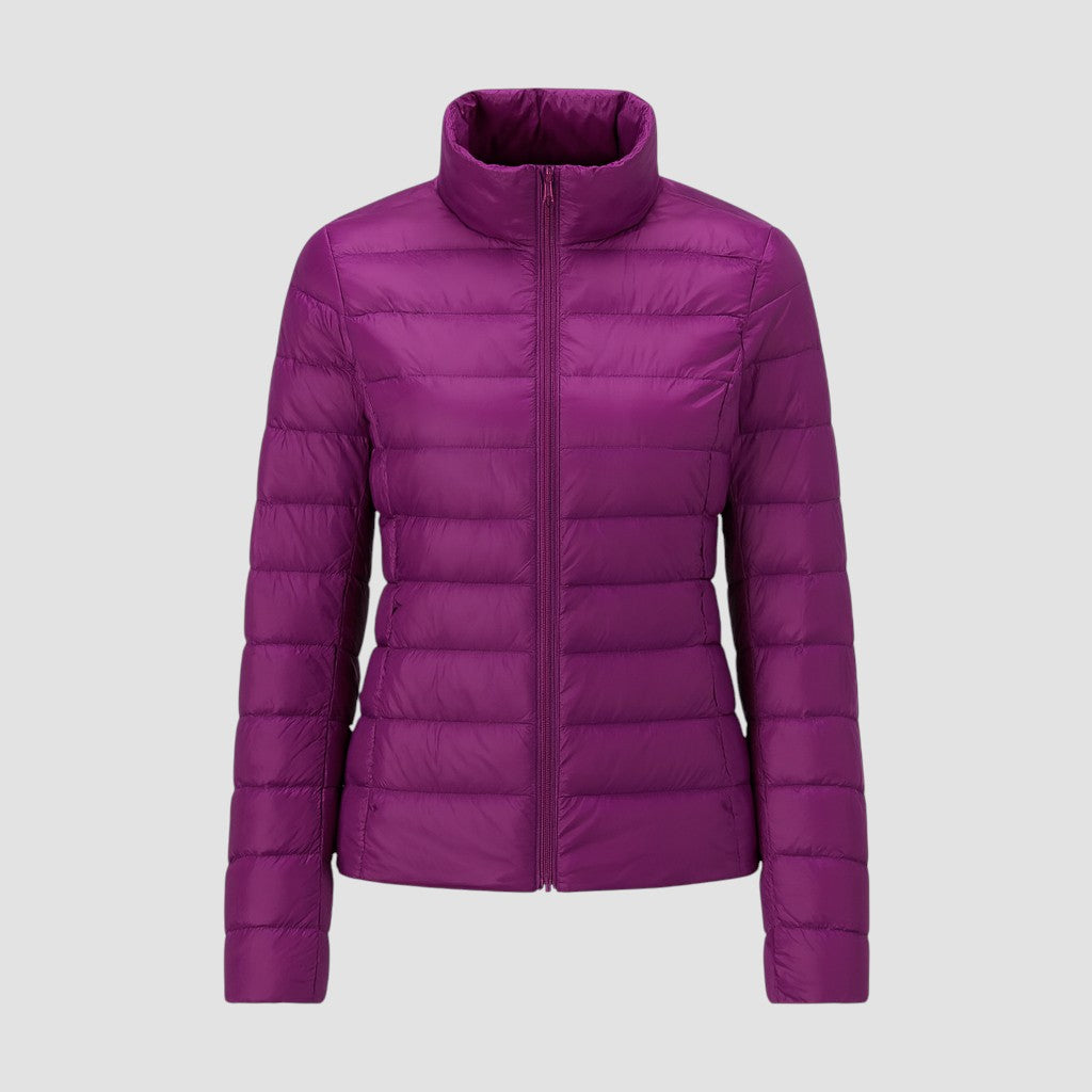A lightweight quilted puffer jacket with a high stand collar, front zipper closure, and long sleeves.
