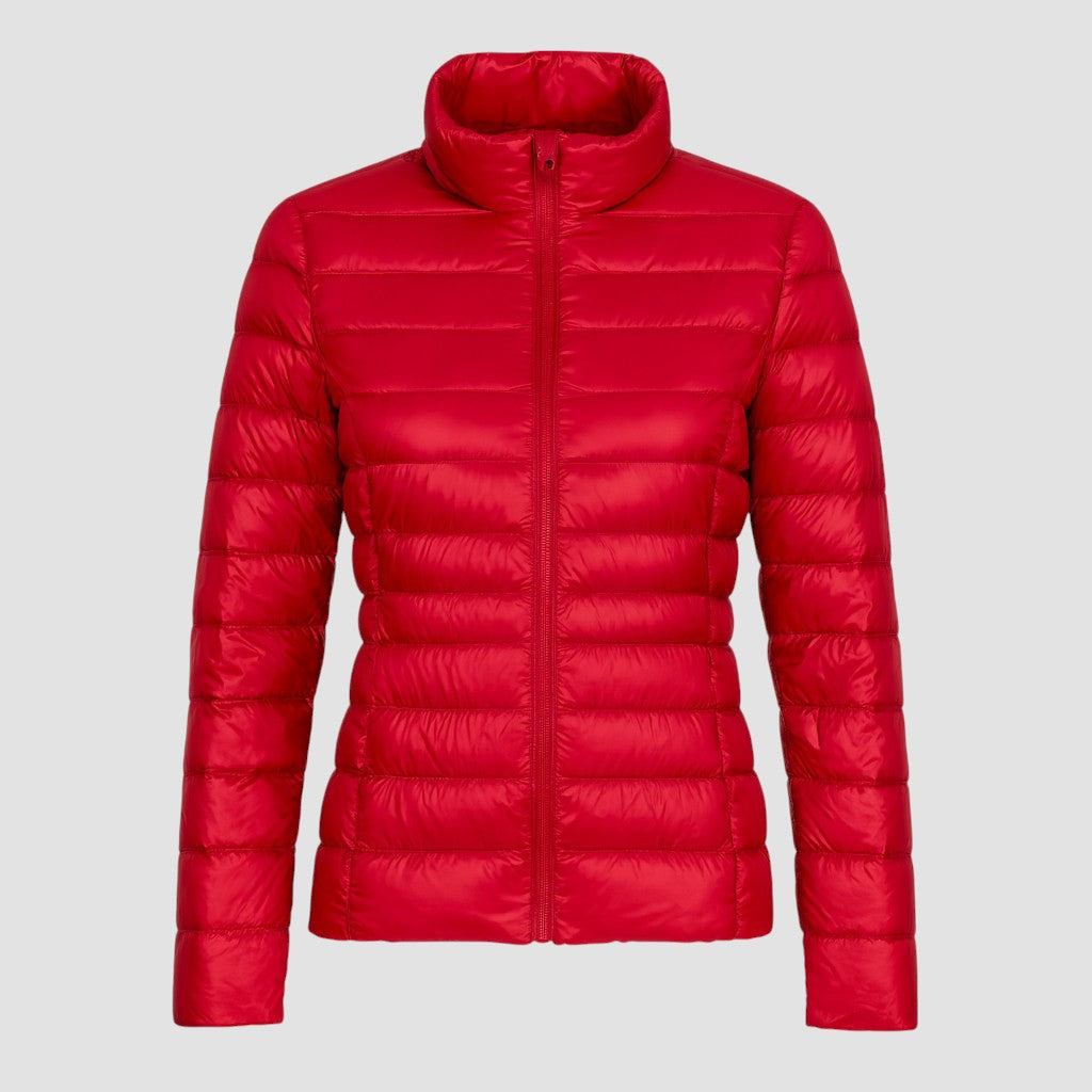 A lightweight quilted puffer jacket with a high stand collar, front zipper closure, and long sleeves.