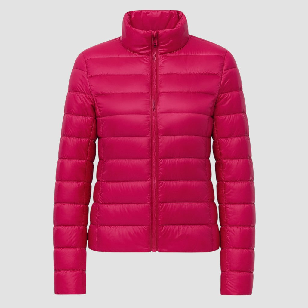 A lightweight quilted puffer jacket with a high stand collar, front zipper closure, and long sleeves.