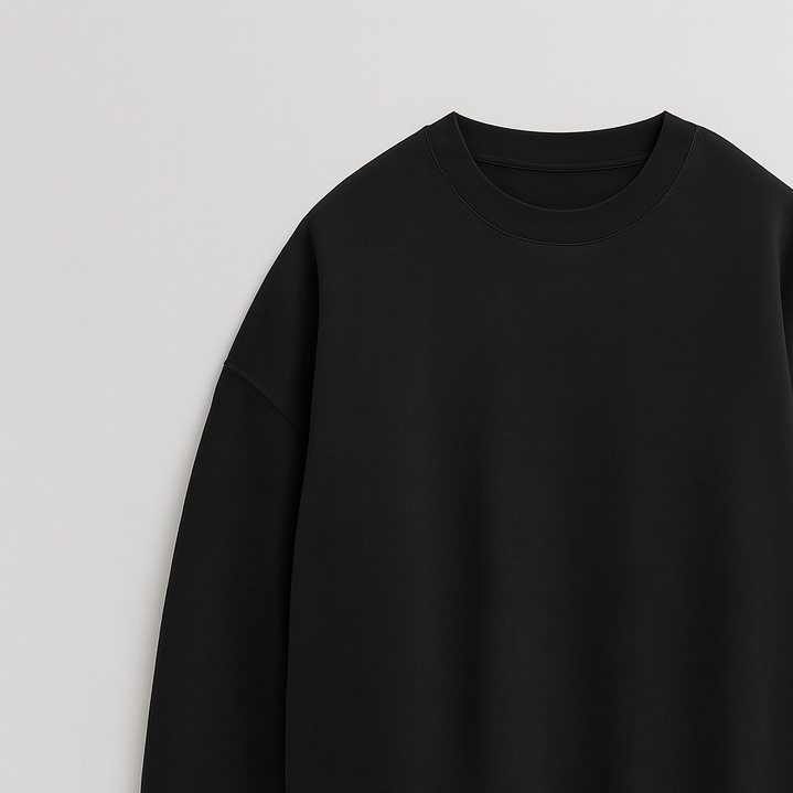 A plain crewneck sweatshirt with long sleeves, ribbed cuffs, hem, and neckline, featuring a relaxed fit.