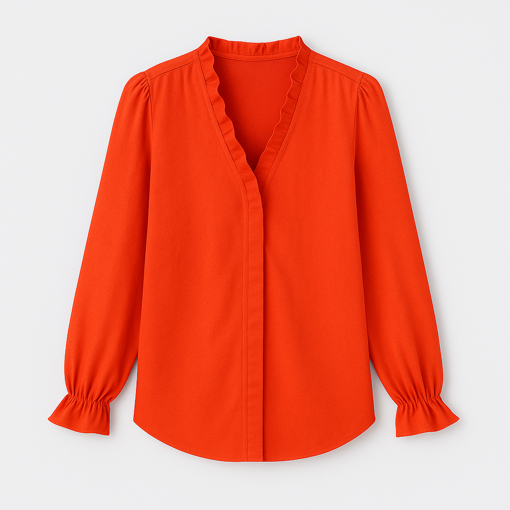 Blouse with V-neckline and ruffle trim along neckline and cuffs.