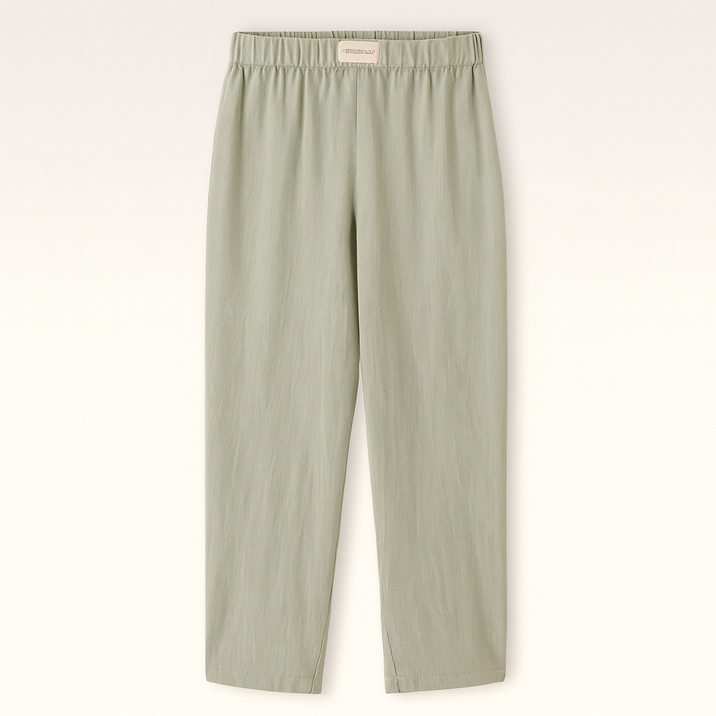 Relaxed cotton pants with elastic waistband and subtle pinstripe texture.