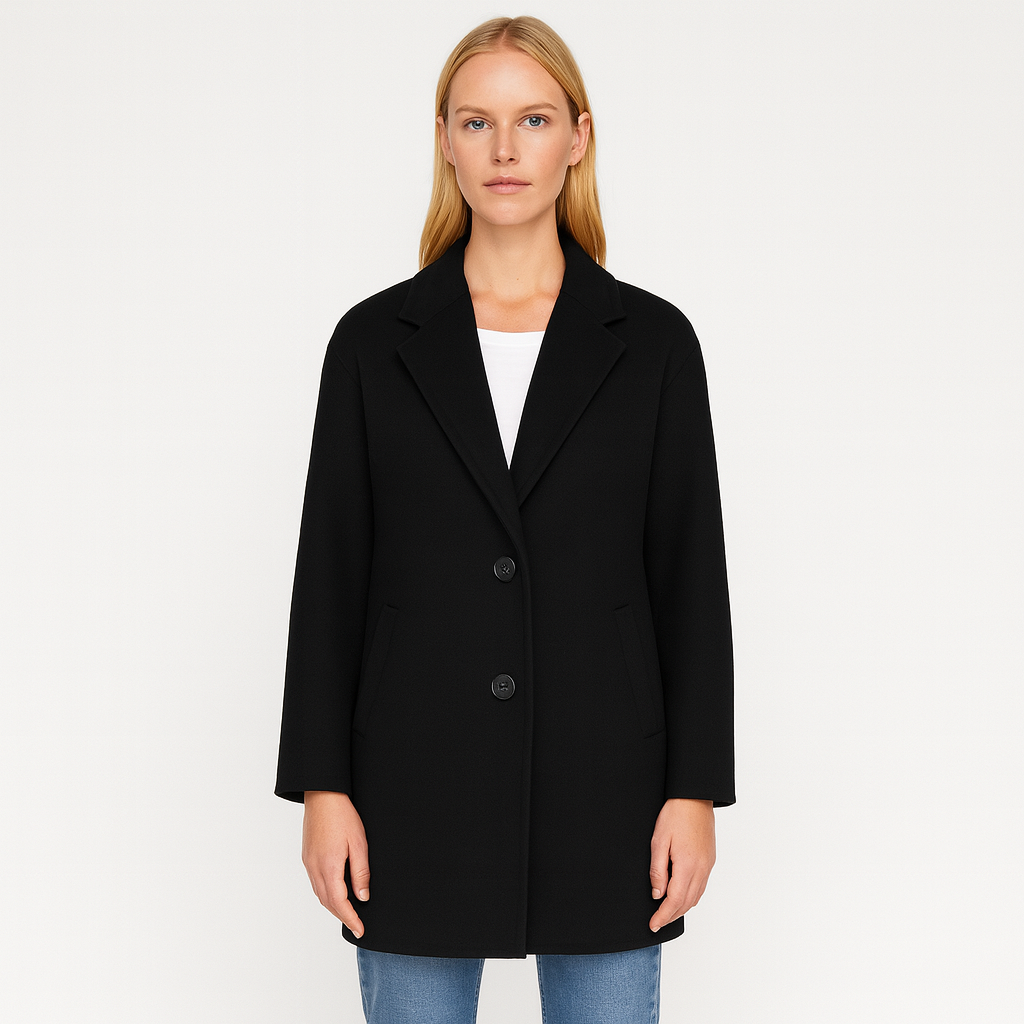 A sleek longline coat featuring a classic notched lapel collar, two-button front closure, and side welt pockets. The minimalist design offers a timeless and sophisticated look suitable for both formal and casual occasions.