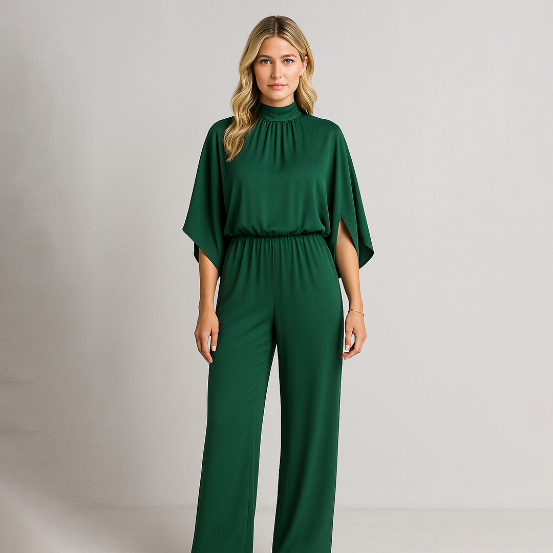 High-neck jumpsuit with wide-leg pants, relaxed fit bodice, and cape-style sleeves.