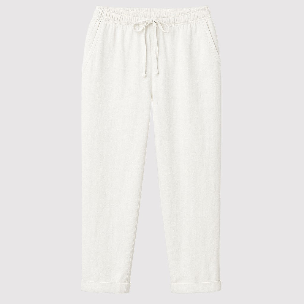 Relaxed linen drawstring pants with straight-leg fit and elastic waistband, styled for a casual everyday look