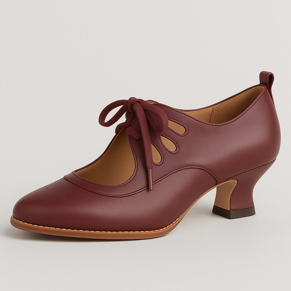 Heeled shoe with lace-up front, cutout details, and rounded square heel.