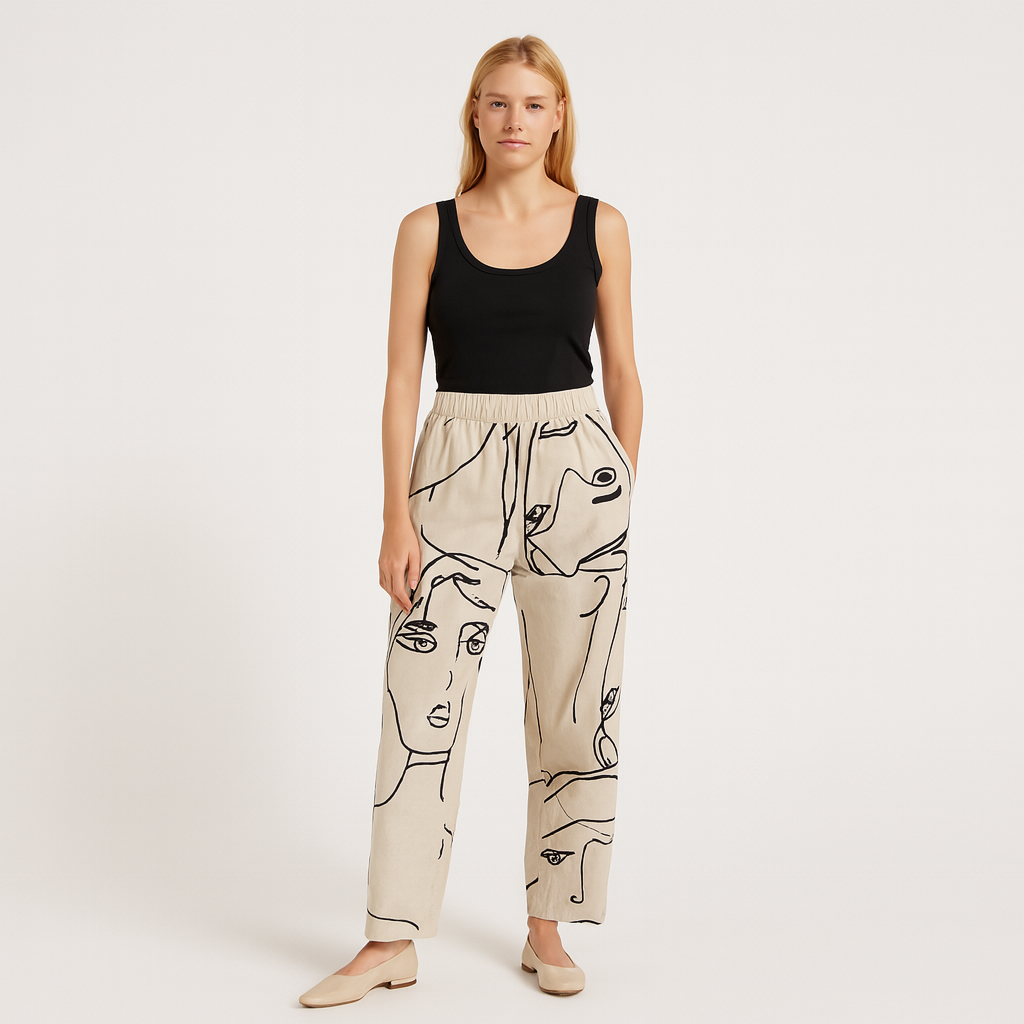 Cropped tapered pants with abstract face line-art print.