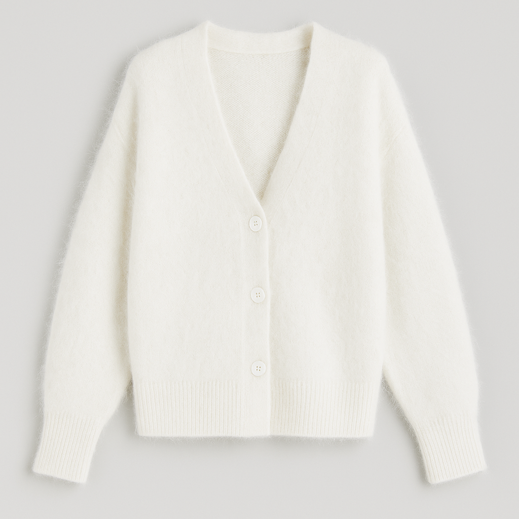 Soft fuzzy cardigan with button front, V-neckline, and relaxed silhouette designed for cozy layering