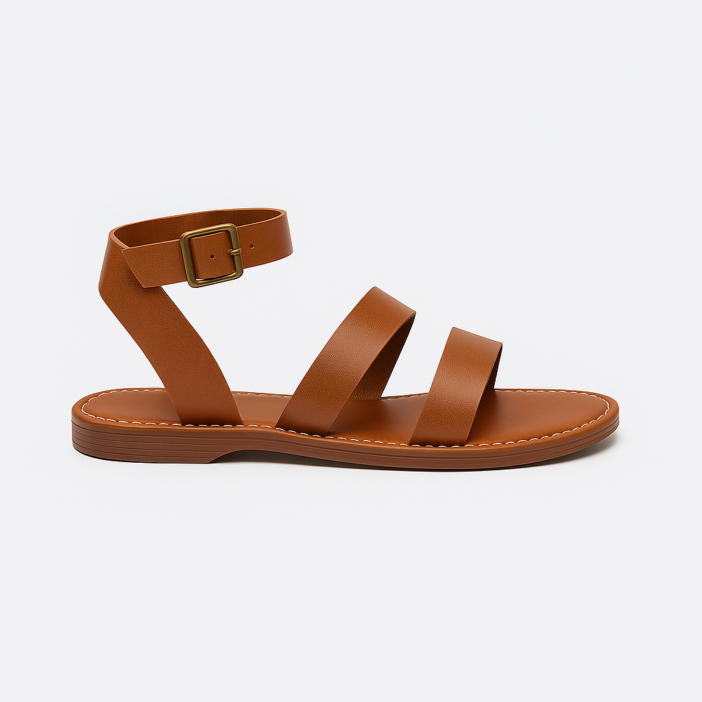 Flat sandal with wide straps, ankle buckle closure, and cushioned sole.