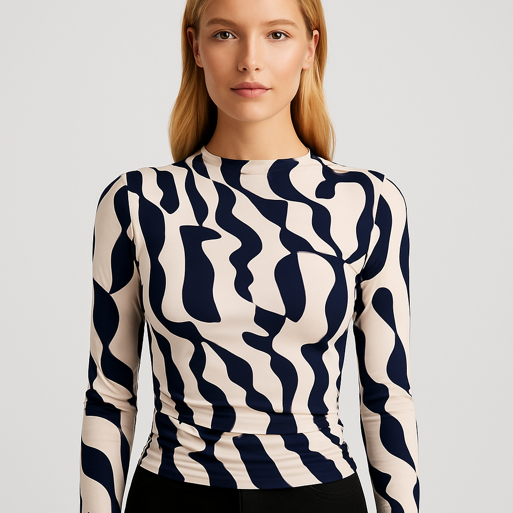 A fitted long-sleeve top with an abstract black-and-white print, high neckline, and ruched detailing for a flattering fit.