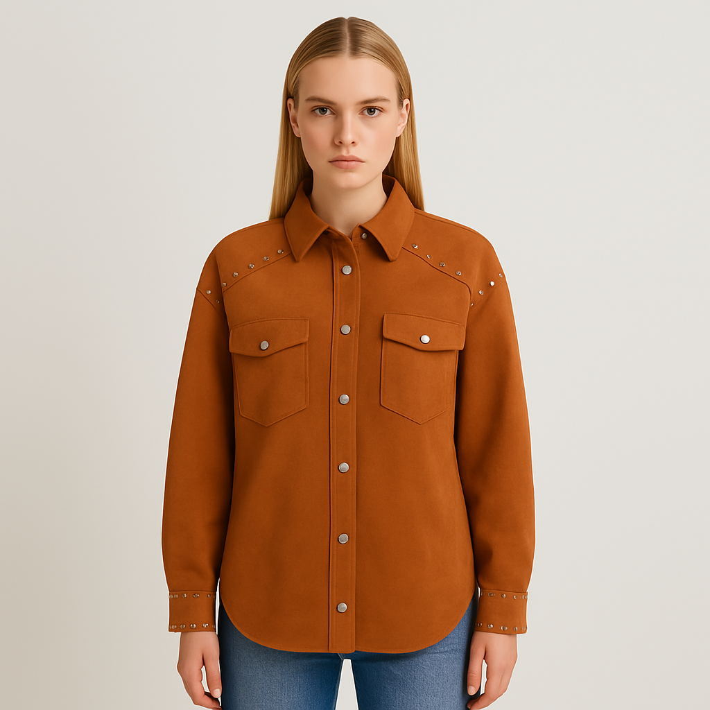 A longline faux suede shirt jacket with silver-tone studs along the shoulders and cuffs, featuring a collared neckline, snap button front, and flap chest pockets.