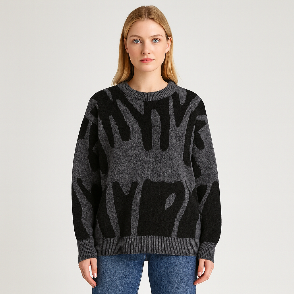 Knit sweater with bold abstract pattern, crew neckline, and ribbed cuffs designed for modern casual wear