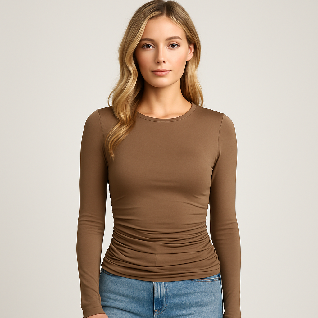 Brown ruched long sleeve fitted top with crew neckline, styled with light wash denim jeans