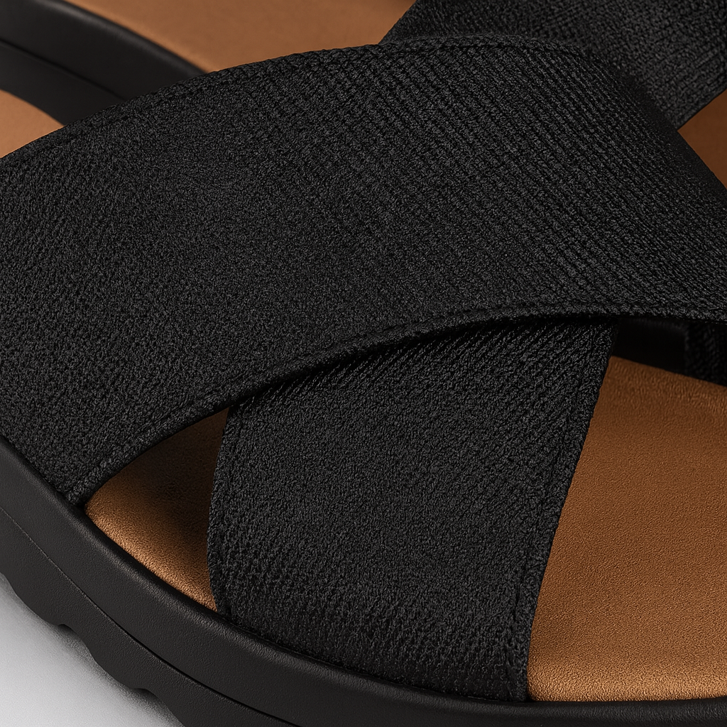 Slide sandal with wide crisscross straps and contoured sole.