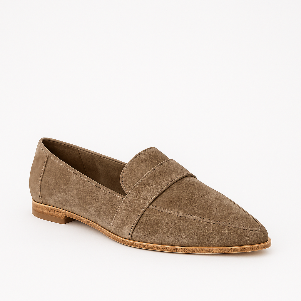 Suede loafer with a pointed toe, low heel, and strap detail across the upper.