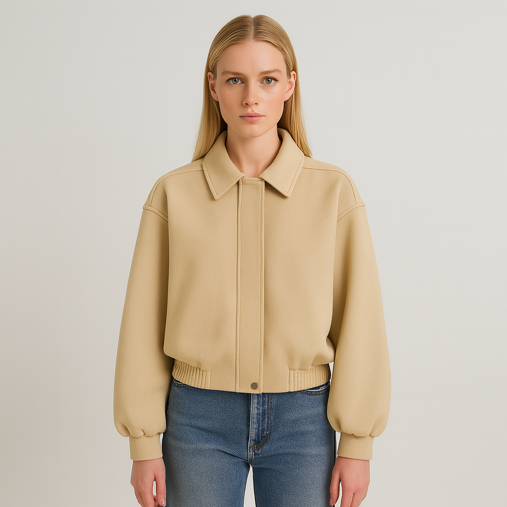 A beige wool-blend bomber jacket with a concealed front, classic collar, long sleeves, and elastic hem for a minimalist refined look.