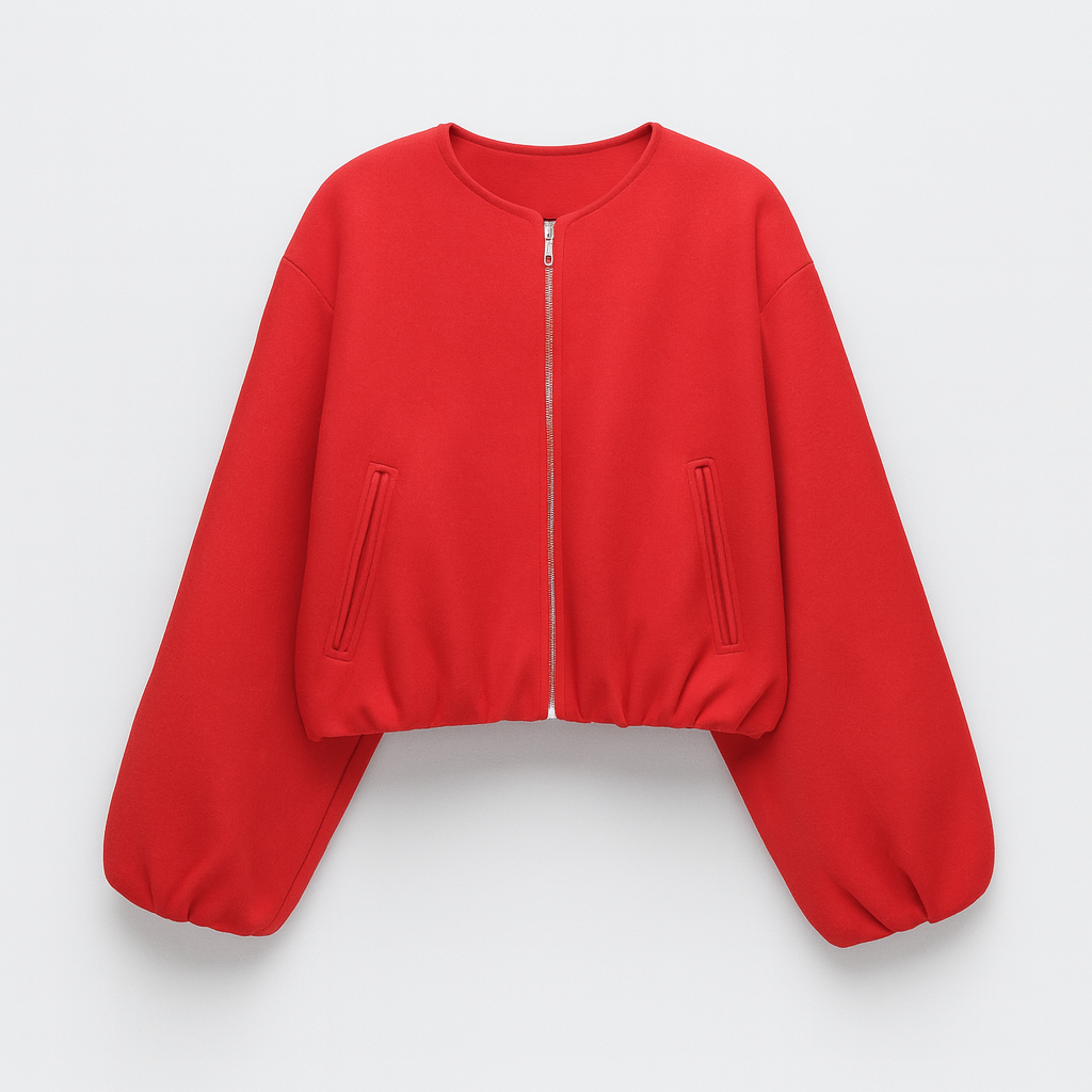 A zip-up jacket featuring a minimalist round neckline, dropped shoulders, and oversized balloon sleeves. The design includes front slit pockets and a gathered hem, creating a relaxed, casual silhouette perfect for layering in cool weather.