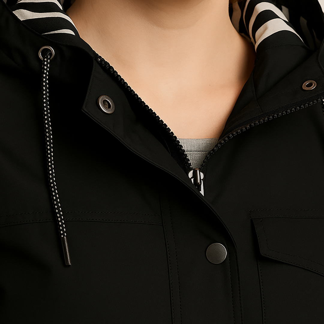 Rain jacket with hood, striped lining, front flap pockets, and button-front closure, styled for casual outdoor wear
