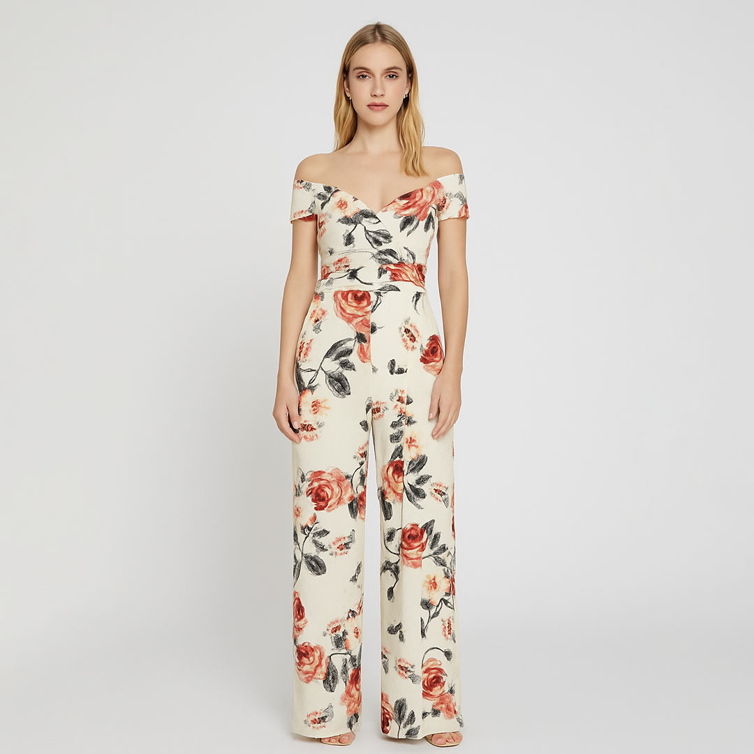 Off-shoulder jumpsuit with a wrap-style bodice, fitted waist, and wide-leg pants featuring an allover floral print.