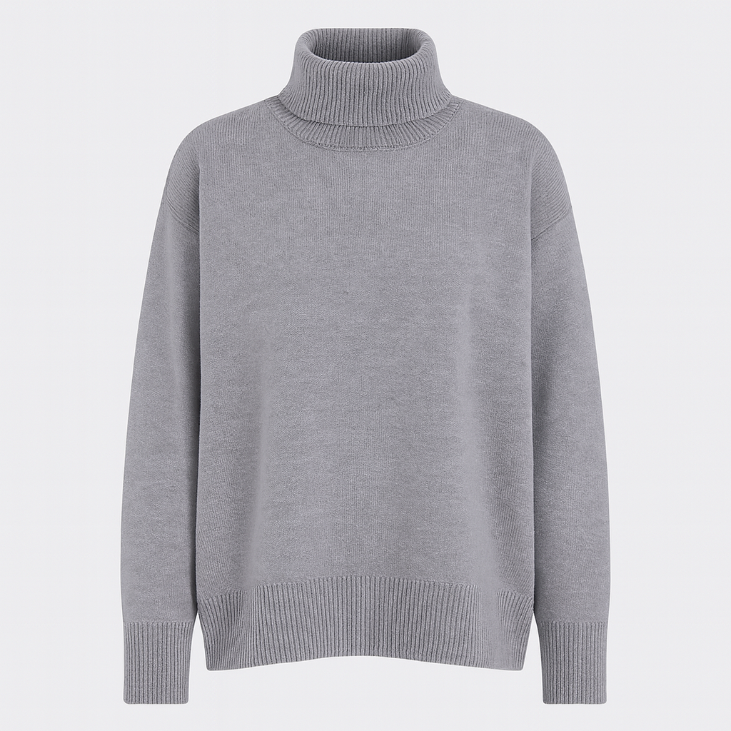 Oversized turtleneck sweater with dropped shoulders, long sleeves, and ribbed cuffs and hem, styled for casual cozy wear