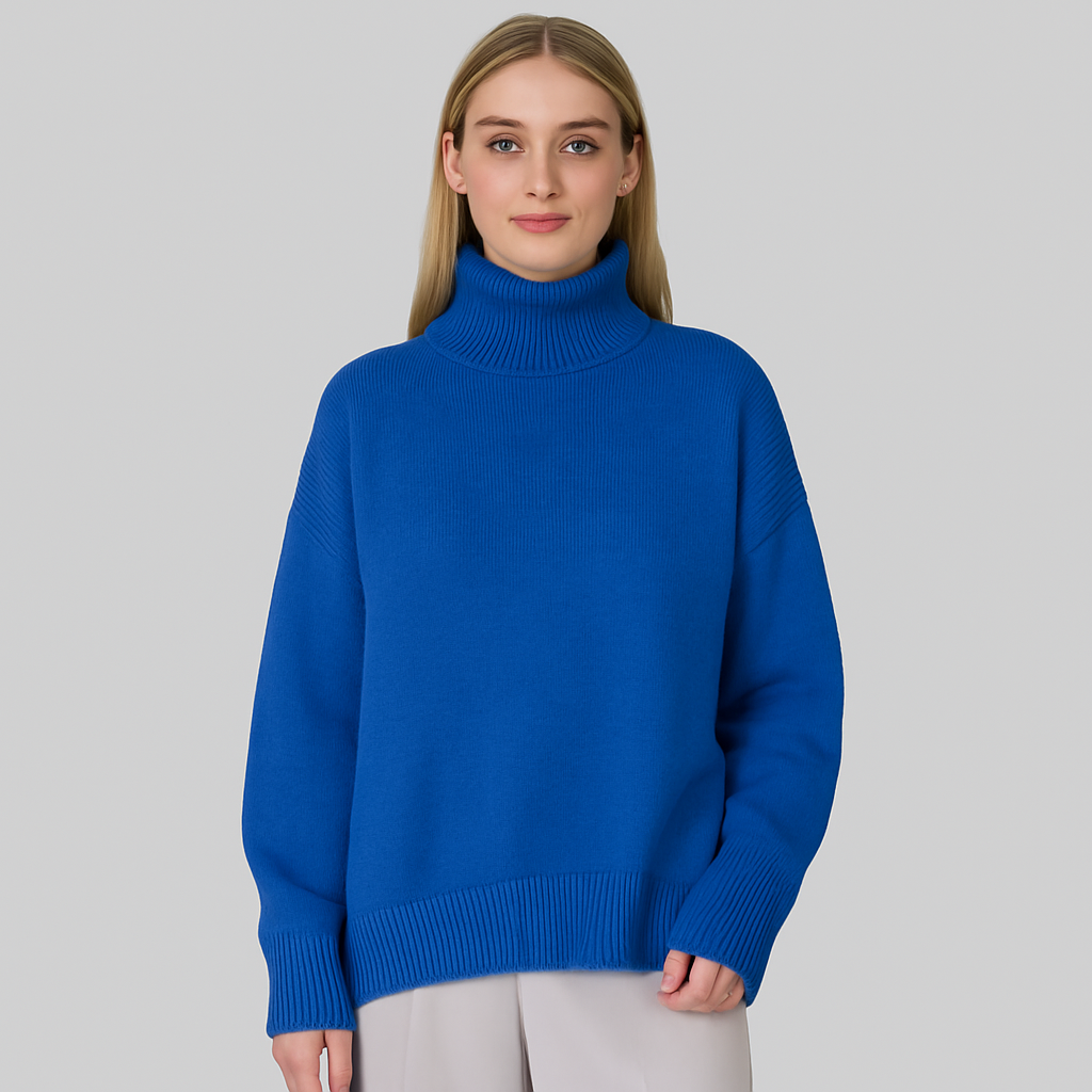 Oversized turtleneck sweater with dropped shoulders, long sleeves, and ribbed cuffs and hem, styled for casual cozy wear