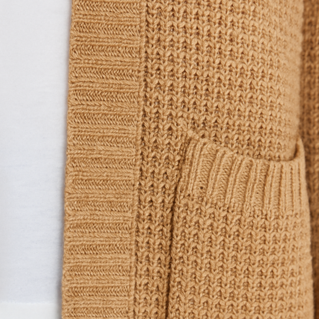 Open-front waffle knit cardigan with long sleeves, ribbed trim, and front patch pockets, designed for casual layering