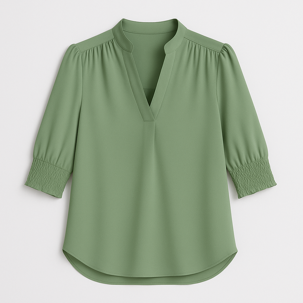 Blouse with V-neckline and smocked short sleeves.