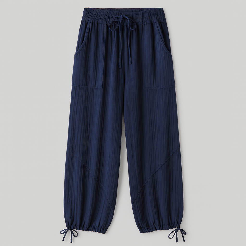 textured wide-leg lounge pants with drawstring waist and cinched hems, styled casually for relaxed wear.