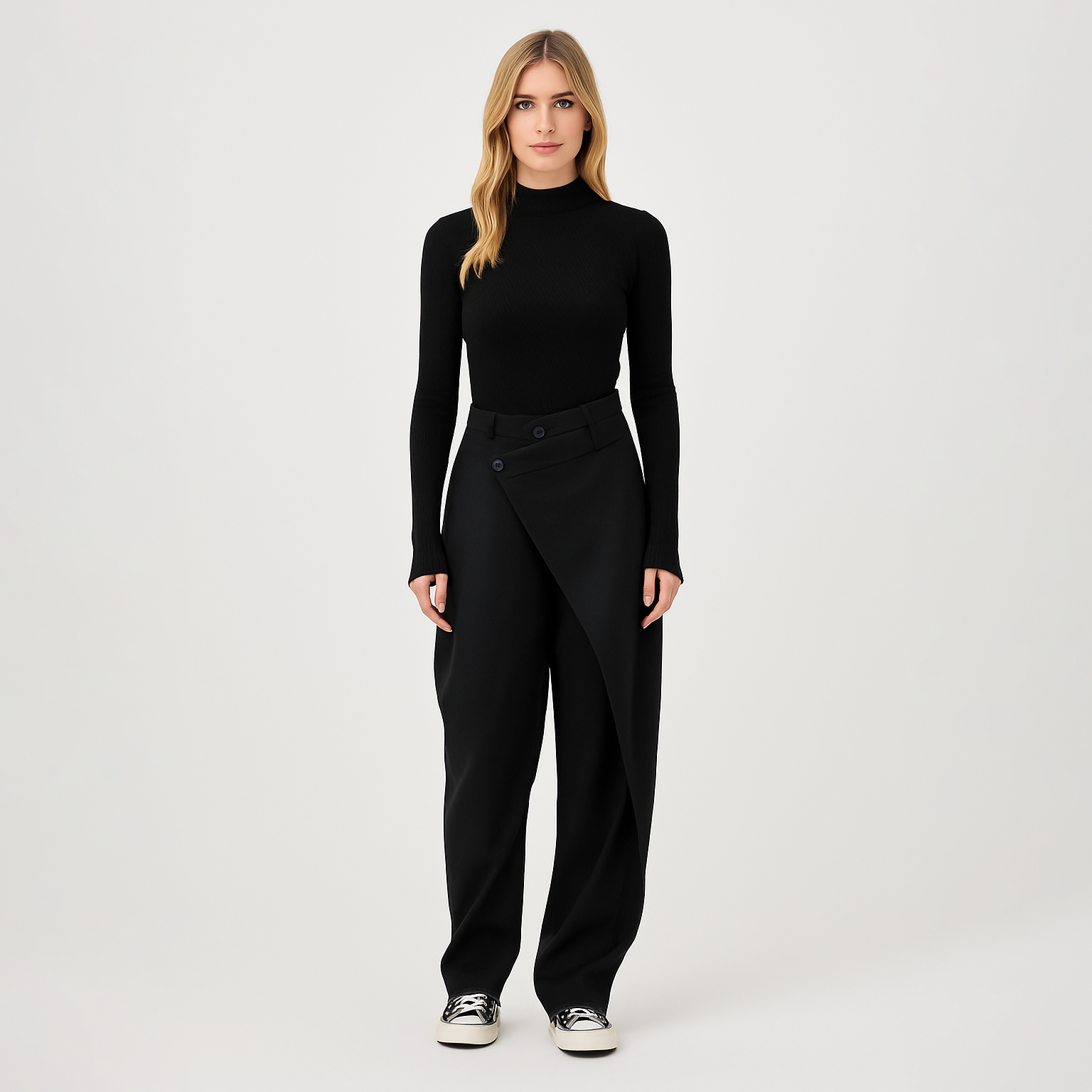 Tailored trousers with asymmetrical wrap-over front detail, single button closure, and cuffed hem, designed for contemporary formal wear