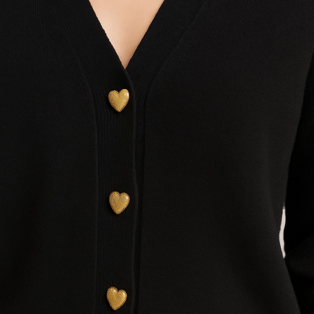 V-neck cardigan with ribbed hem and cuffs, front closure featuring heart-shaped buttons, designed for casual layering wear