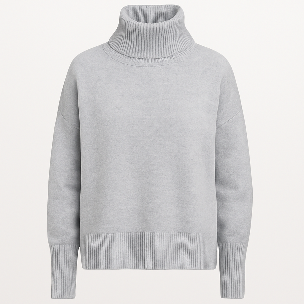 An oversized turtleneck sweater with long sleeves, ribbed cuffs, hem, and a tall ribbed fold-over neckline.