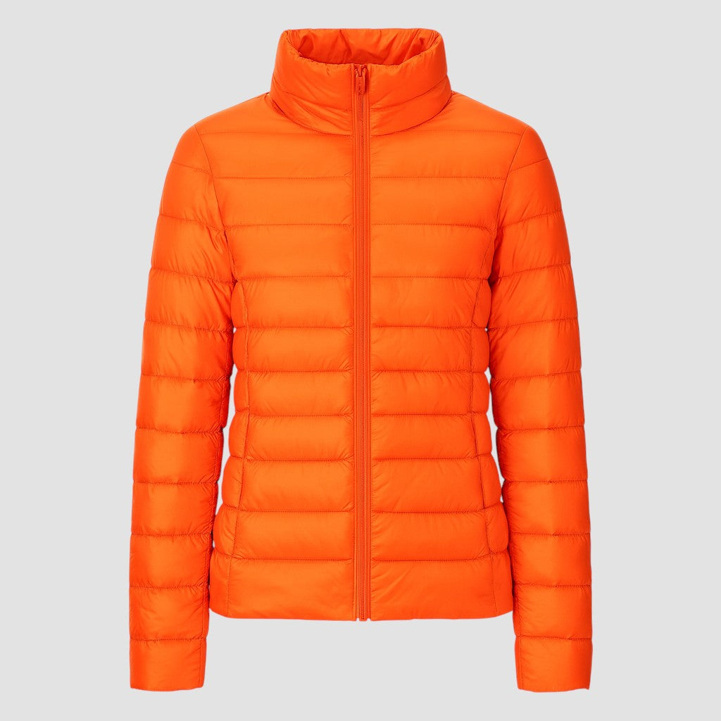 A lightweight quilted puffer jacket with a high stand collar, front zipper closure, and long sleeves.