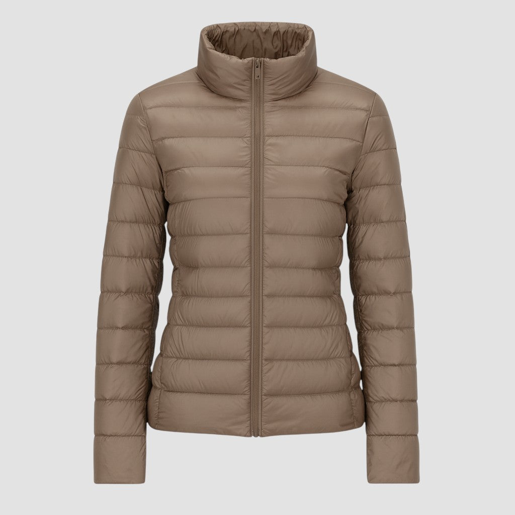 A lightweight quilted puffer jacket with a high stand collar, front zipper closure, and long sleeves.