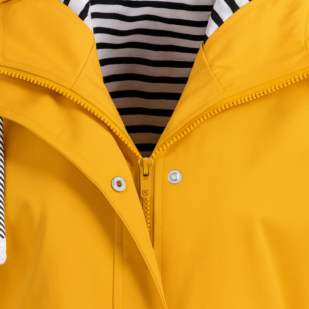 Rain jacket with a striped inner lining, front snap buttons, zipper closure, drawstring hood, and two flap pockets.