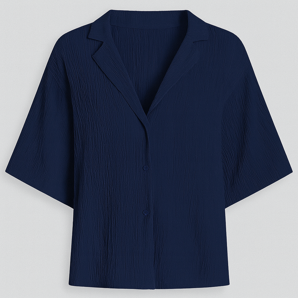 Navy blue relaxed-fit shirt with short sleeves, button-down front, and open collar.