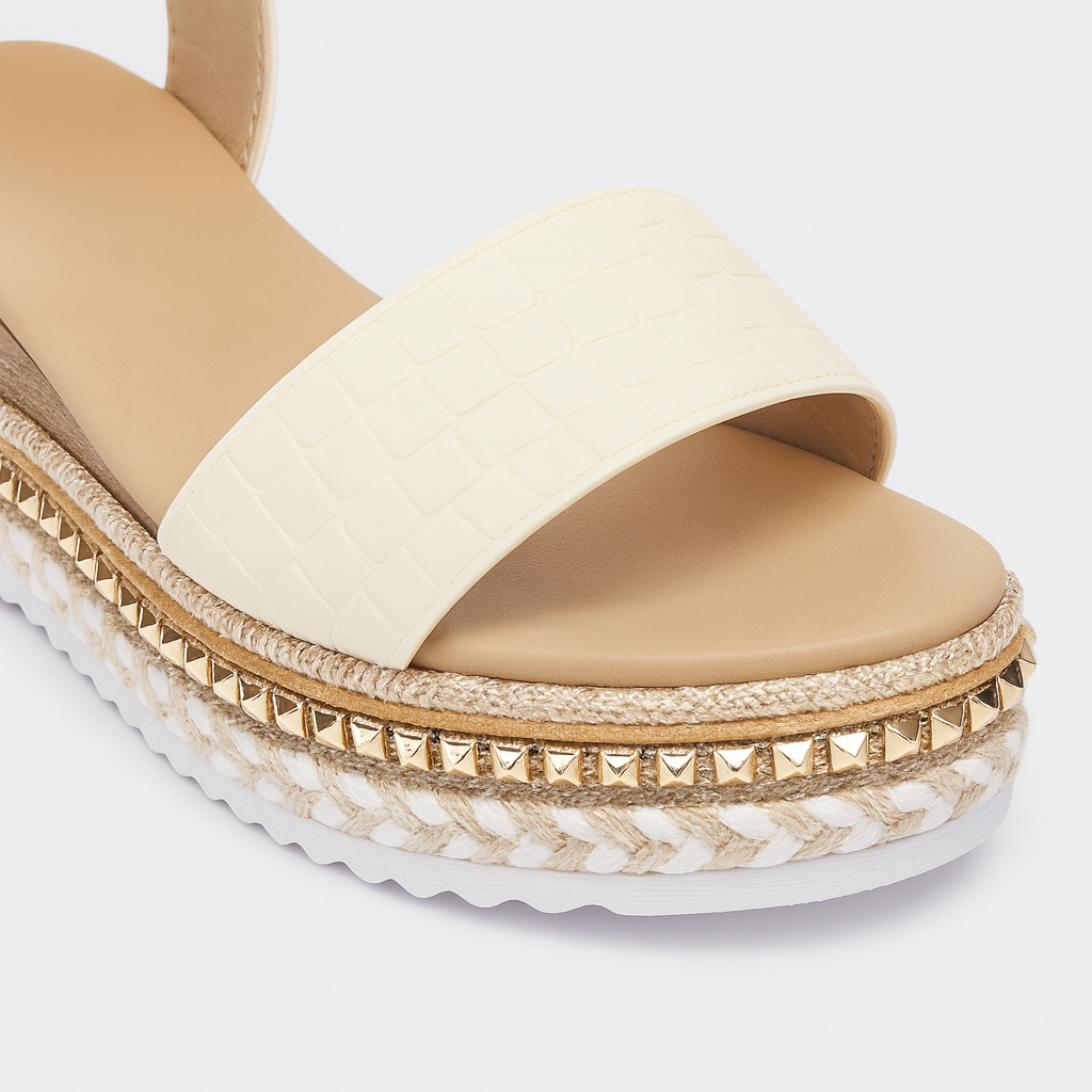 Platform sandal with ankle strap, buckle closure, and woven detailing on the midsole.