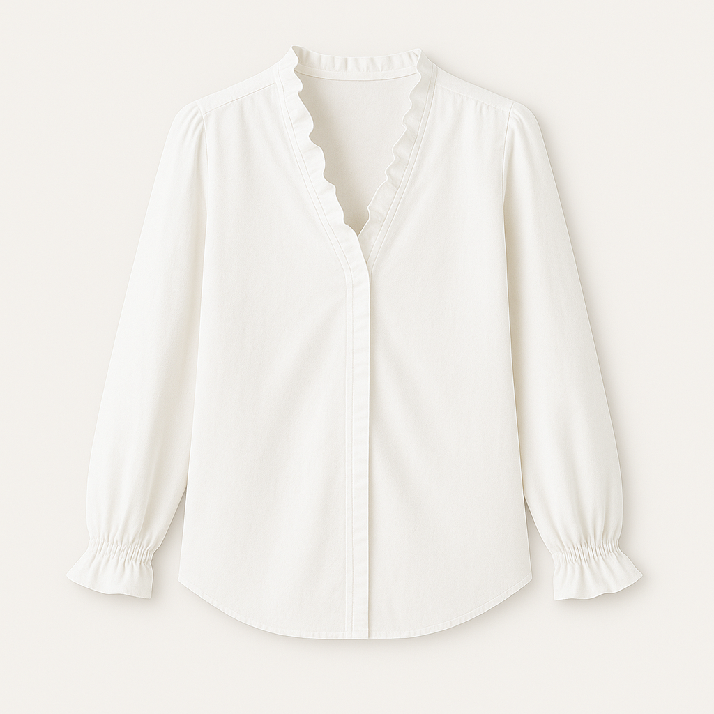 Blouse with V-neckline and ruffle trim along neckline and cuffs.