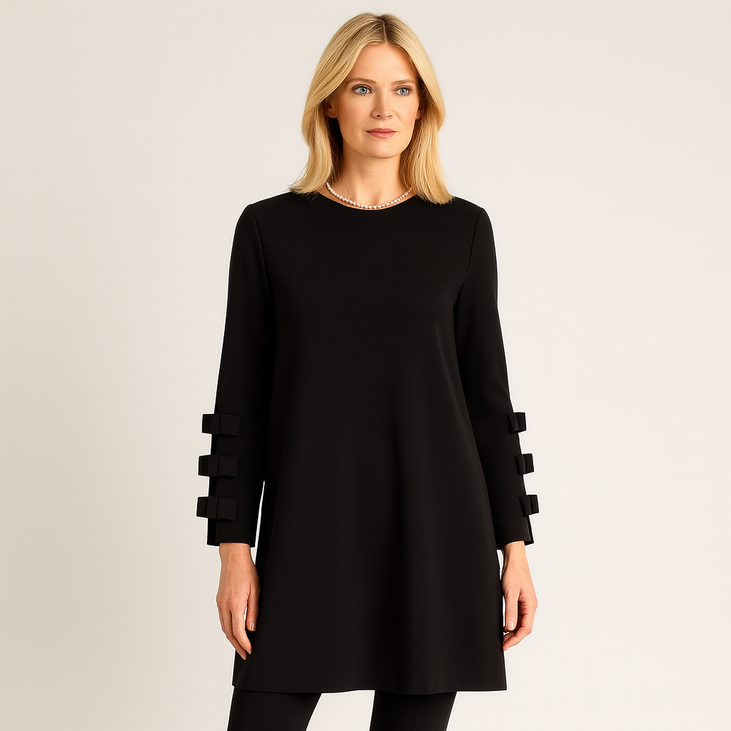 Long-sleeve shift dress featuring a round neckline and decorative bow accents on the sleeves.