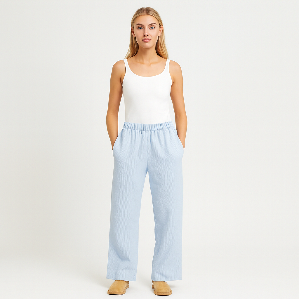 Relaxed cotton pants with elastic waistband and subtle pinstripe texture.