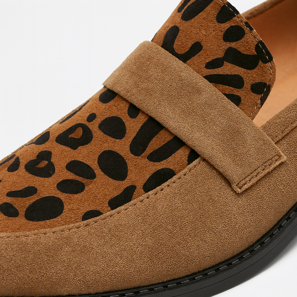 Loafer shoe with a low block heel and animal print detail on the upper.