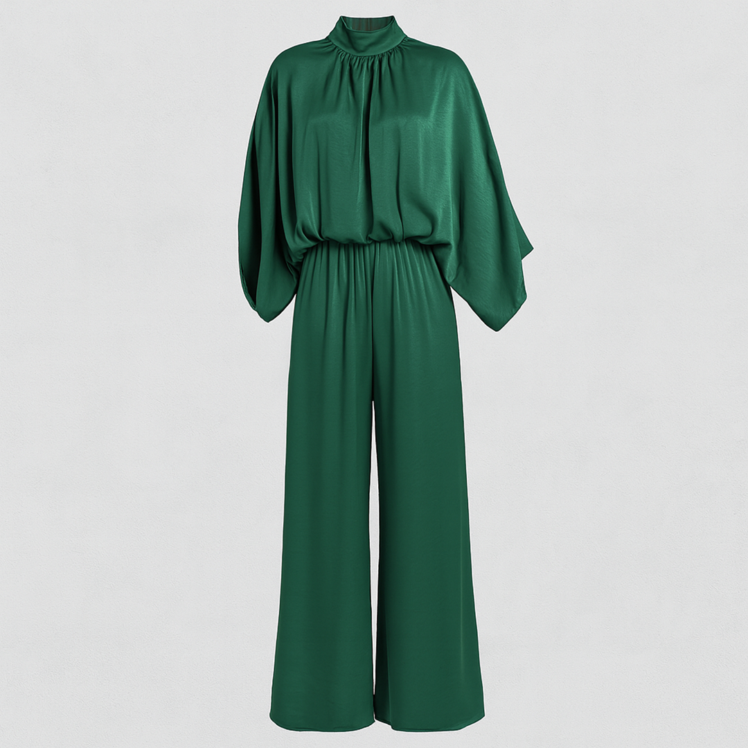 High-neck jumpsuit with wide-leg pants, relaxed fit bodice, and cape-style sleeves.