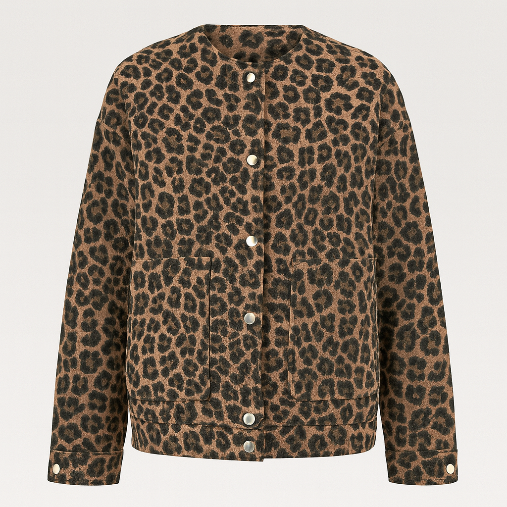 Cozy leopard print jacket with button front, hip length, and relaxed fit, styled with dark jeans and a black top.
