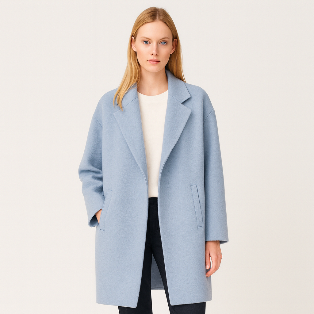 Long oversized coat with a notched lapel collar, straight silhouette, and two front welt pockets.