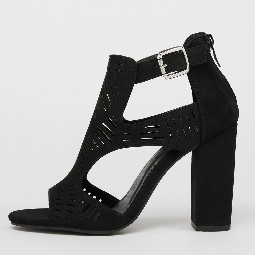 Black faux suede block heel sandals with cut-out design, open toe, and ankle strap with buckle fastening.