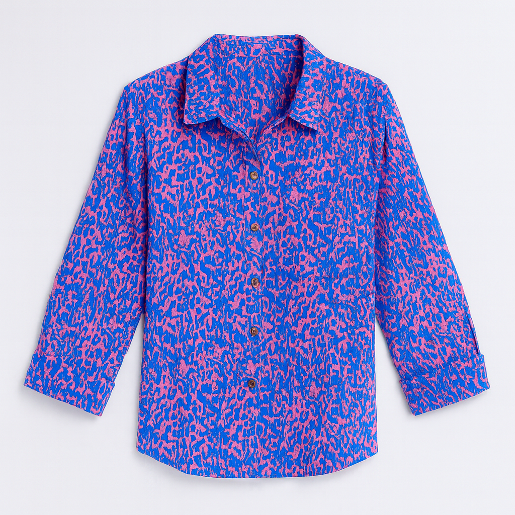 Button-up shirt with a bold blue and pink abstract animal print, featuring a pointed collar and long sleeves.