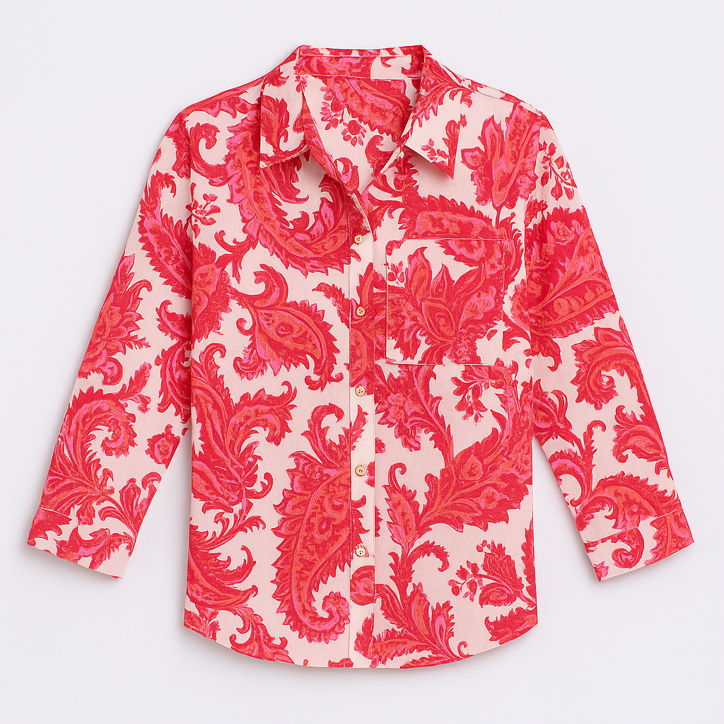 Button-up shirt with a bold blue and pink abstract animal print, featuring a pointed collar and long sleeves.