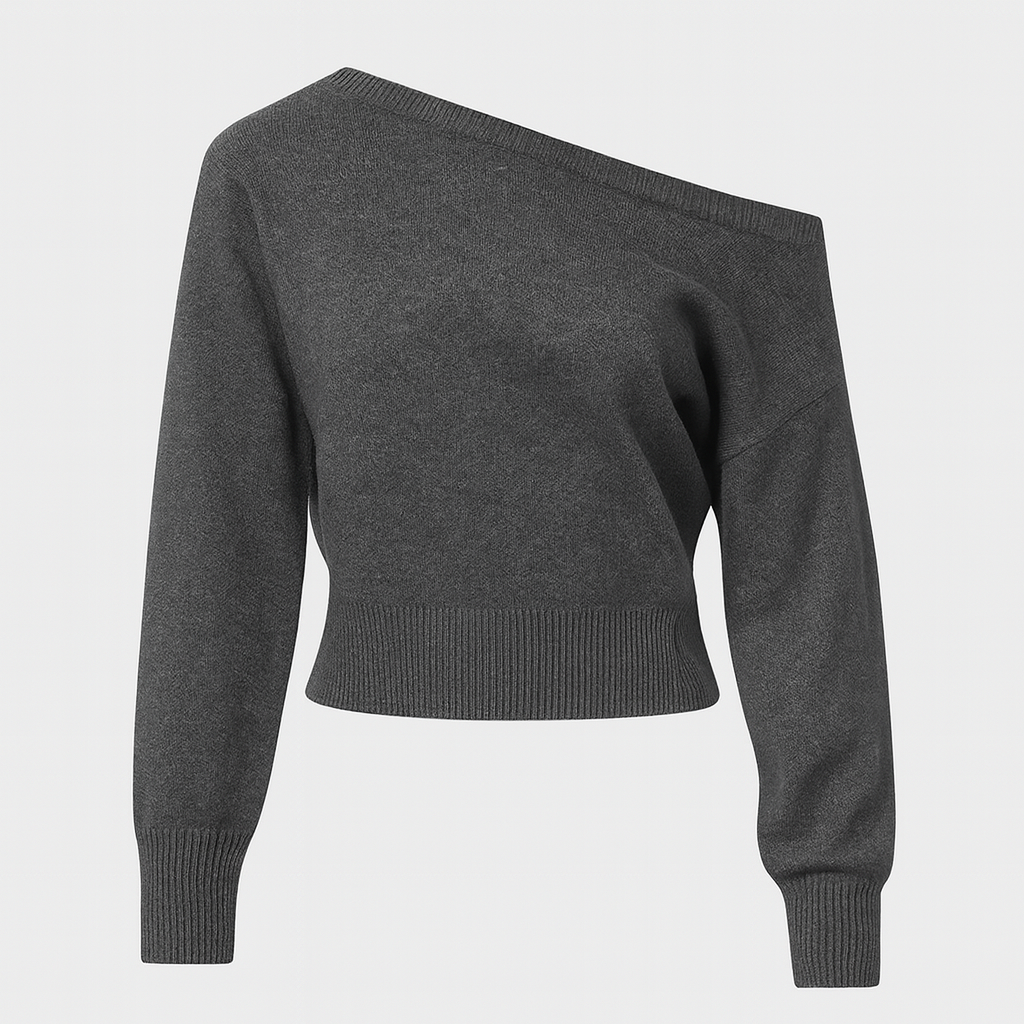 Charcoal grey off shoulder knit sweater with ribbed hem and cuffs, styled with a dark skirt for an edgy casual look