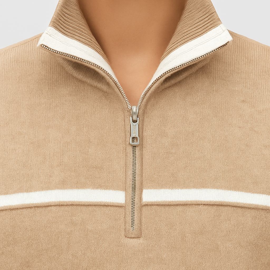 A beige half-zip pullover sweater with white trim