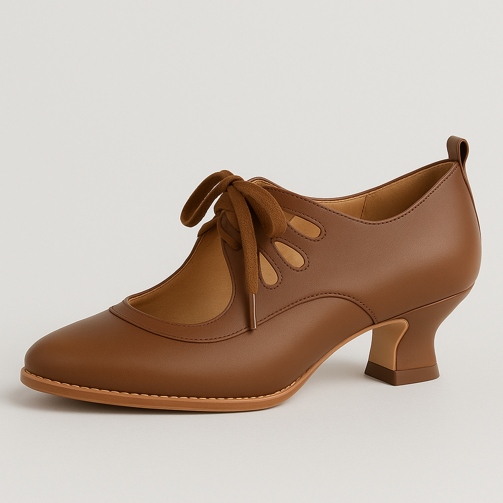 Heeled shoe with lace-up front, cutout details, and rounded square heel.